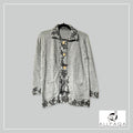 Handmade alpaca button-up cardigan in light grey with black nature details