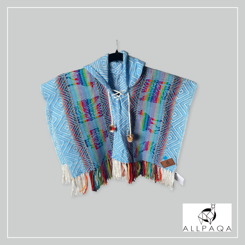 Handmade kids alpaca poncho in blue with multicolour alpaca pattern