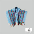 Handmade kids alpaca poncho in blue with multicolour alpaca pattern