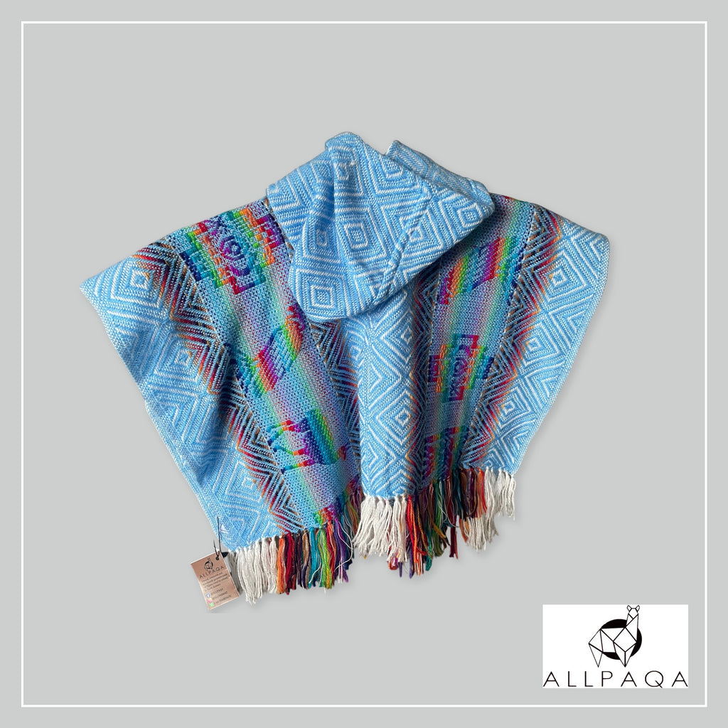 Handmade kids alpaca poncho in blue with multicolour alpaca pattern
