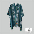 Handmade alpaca poncho in turquoise green with blue strips