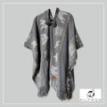 Handmade alpaca poncho in light grey with brown strips