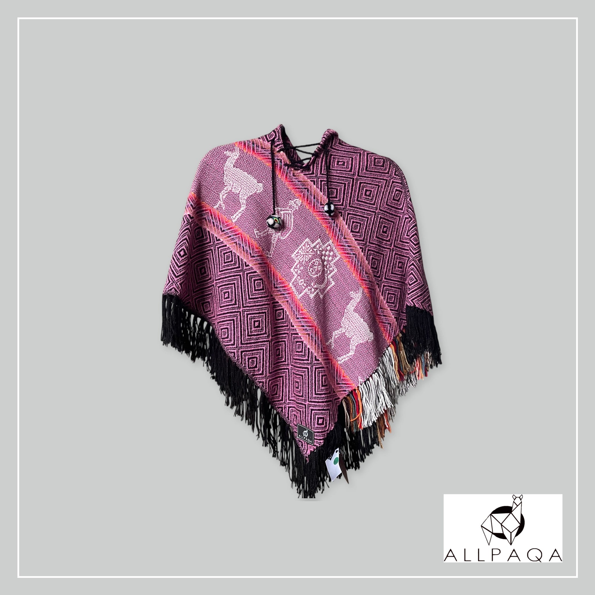 Handmade kids alpaca poncho in deep pink with alpaca pattern
