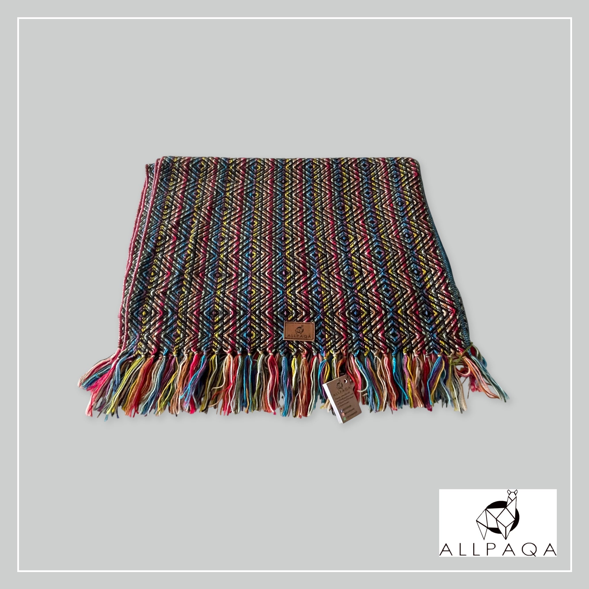 Handmade alpaca shawl in black with multicoloured strips