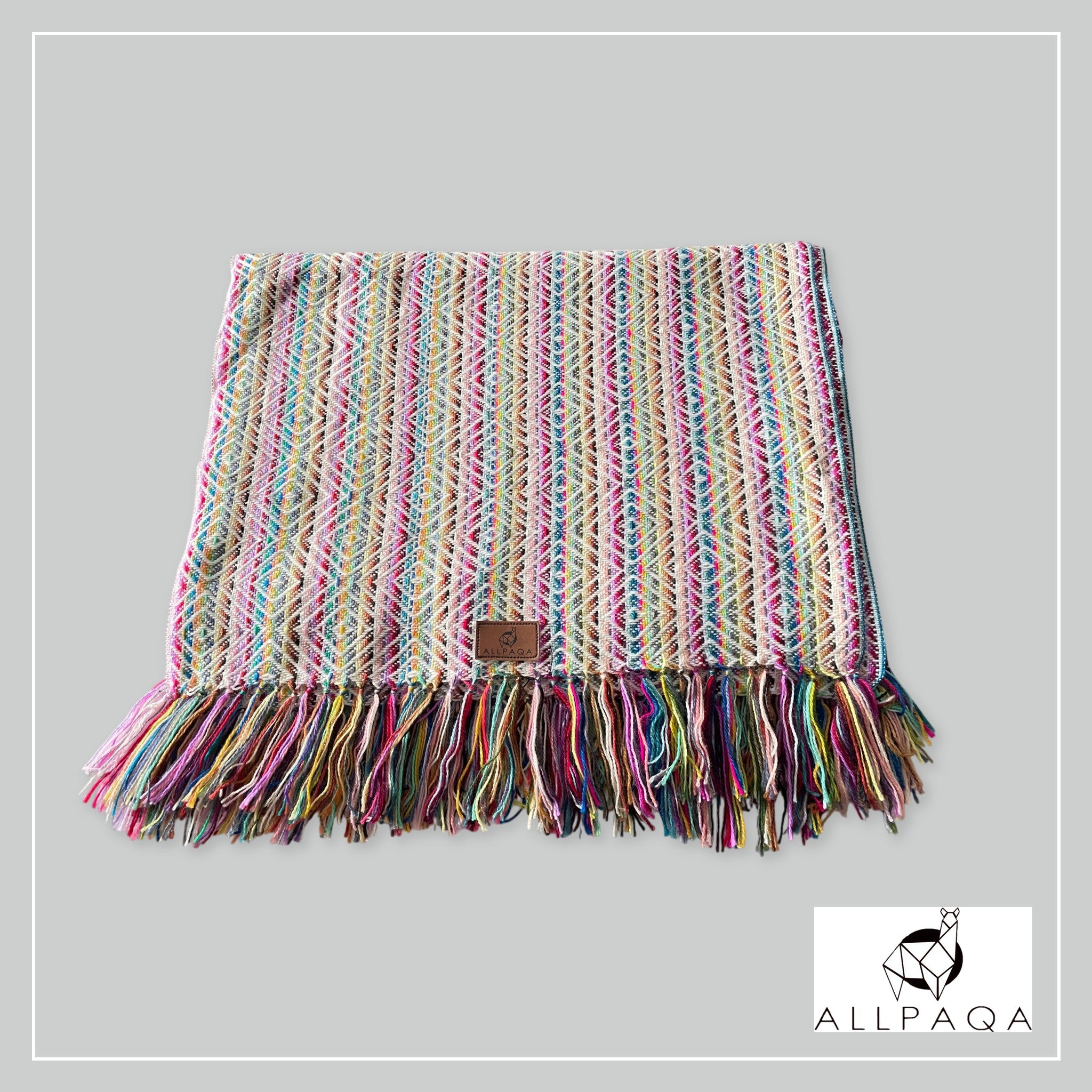 Handmade alpaca shawl in pink with multicoloured strips