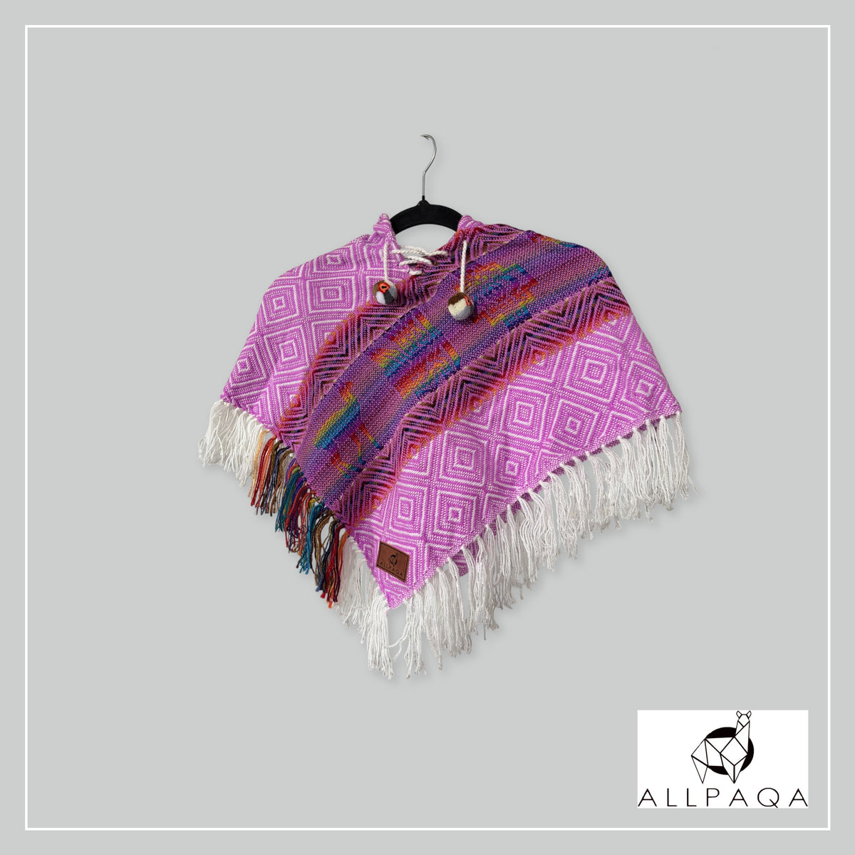 Handmade alpaca poncho in Bright pink with stripes and alpaca patterns in rainbow colours
