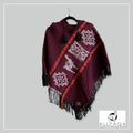 Handmade alpaca poncho in Burgundy with red - oranges stripes and andean patterns in white