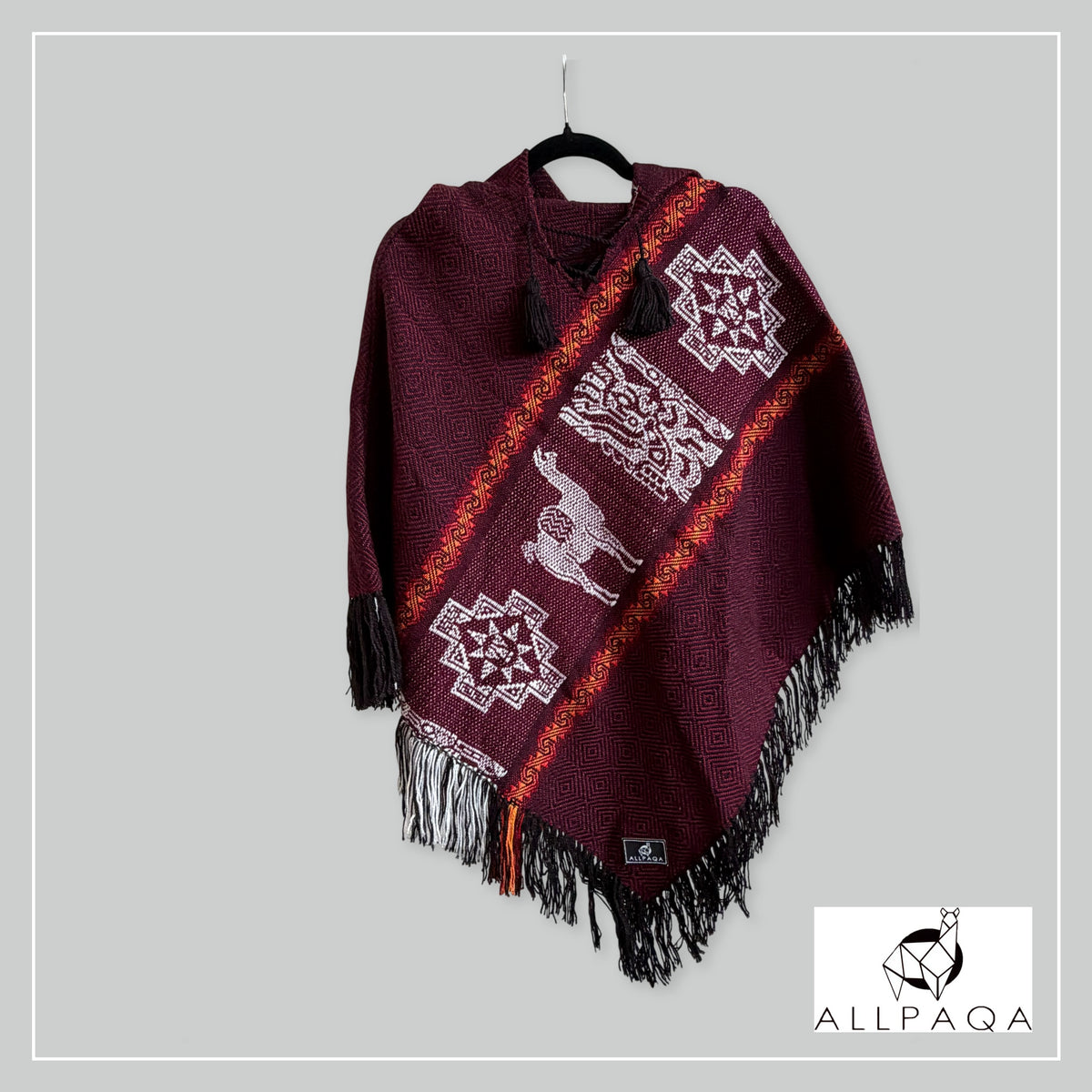 Handmade alpaca poncho in Burgundy with red - oranges stripes and andean patterns in white