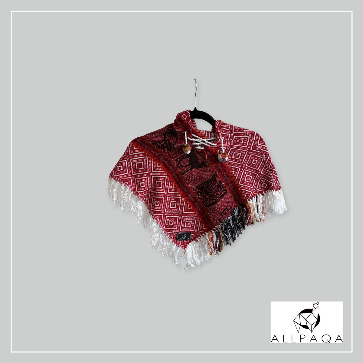 Handmade alpaca poncho in Red tones with Andean pattern in black
