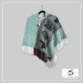 Handmade alpaca poncho in Light summer green with multicolour stripes and andean patterns in black