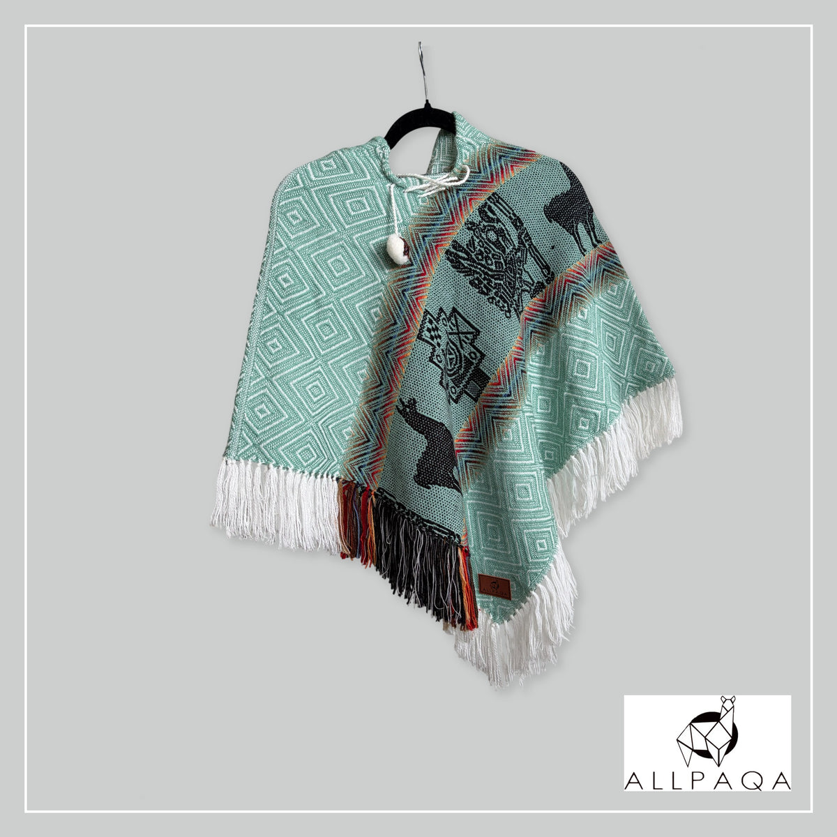 Handmade alpaca poncho in Light summer green with multicolour stripes and andean patterns in black