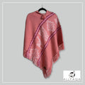 Handmade alpaca poncho in Salmon pink with pink - purple stripes and andean patterns in white