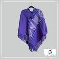 Handmade alpaca poncho in Purple with shades of blue stripes and andean patterns in white