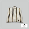Allpaqa NZ white alpaca poncho with brown stripes and fringe detail. Hooded with drawstring.